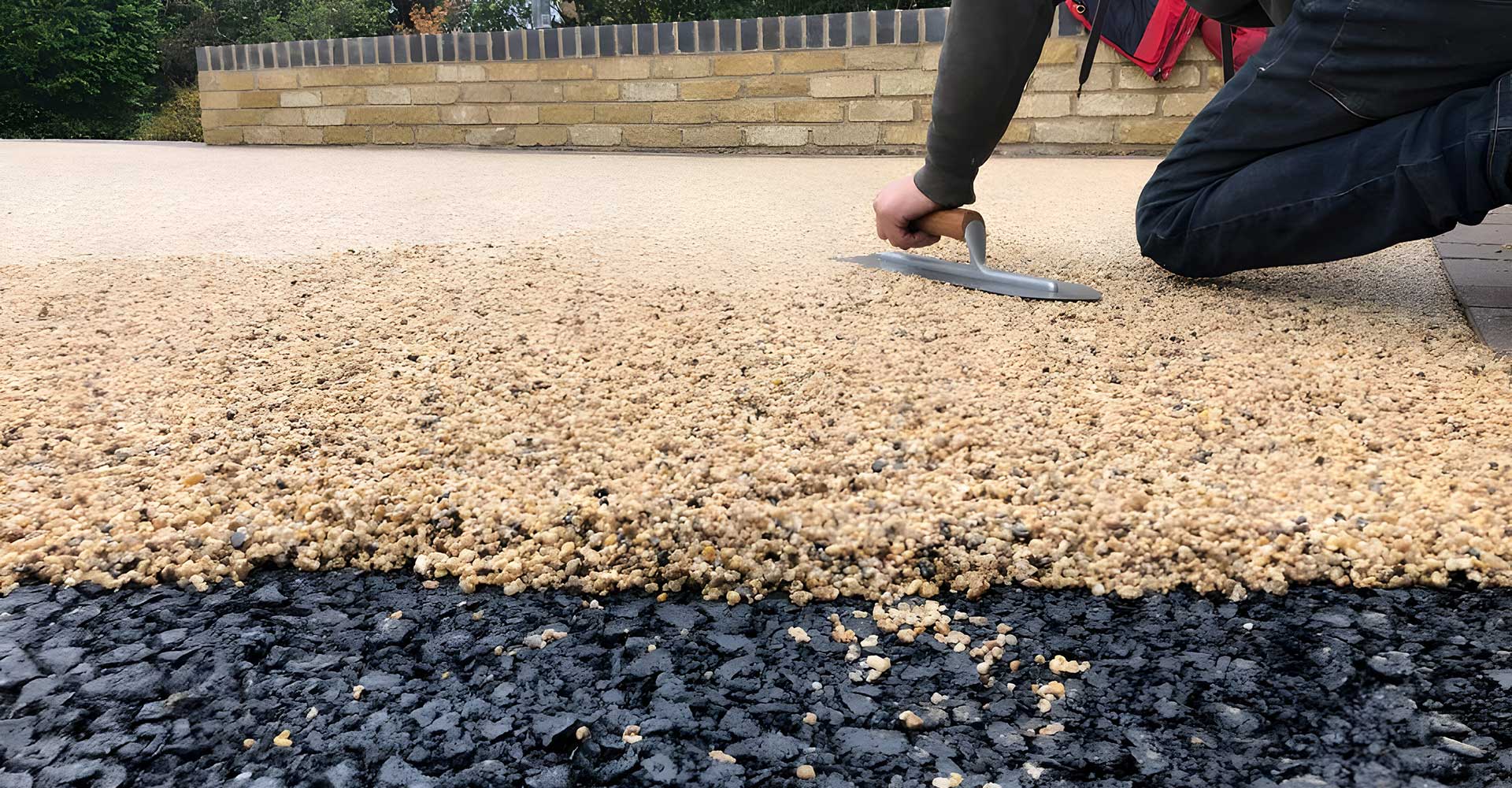 Nice Drives at work installing resin driveway